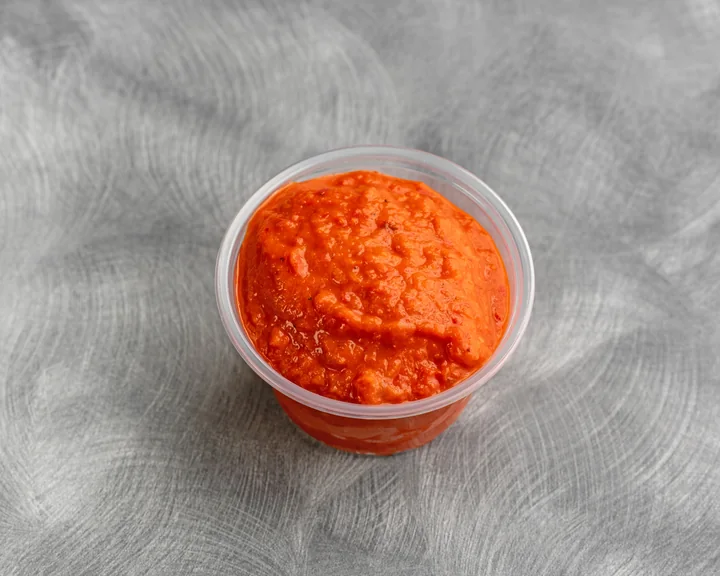 A bowl of bright roasted red pepper ajvar